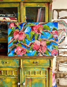 Naming Your Art example: a floral painting featuring pink and red flowers and green leaves over a blue background. Titled Gracious Heart